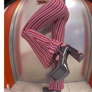 Women’s flattering high rise flared pants.  Red and pink. L